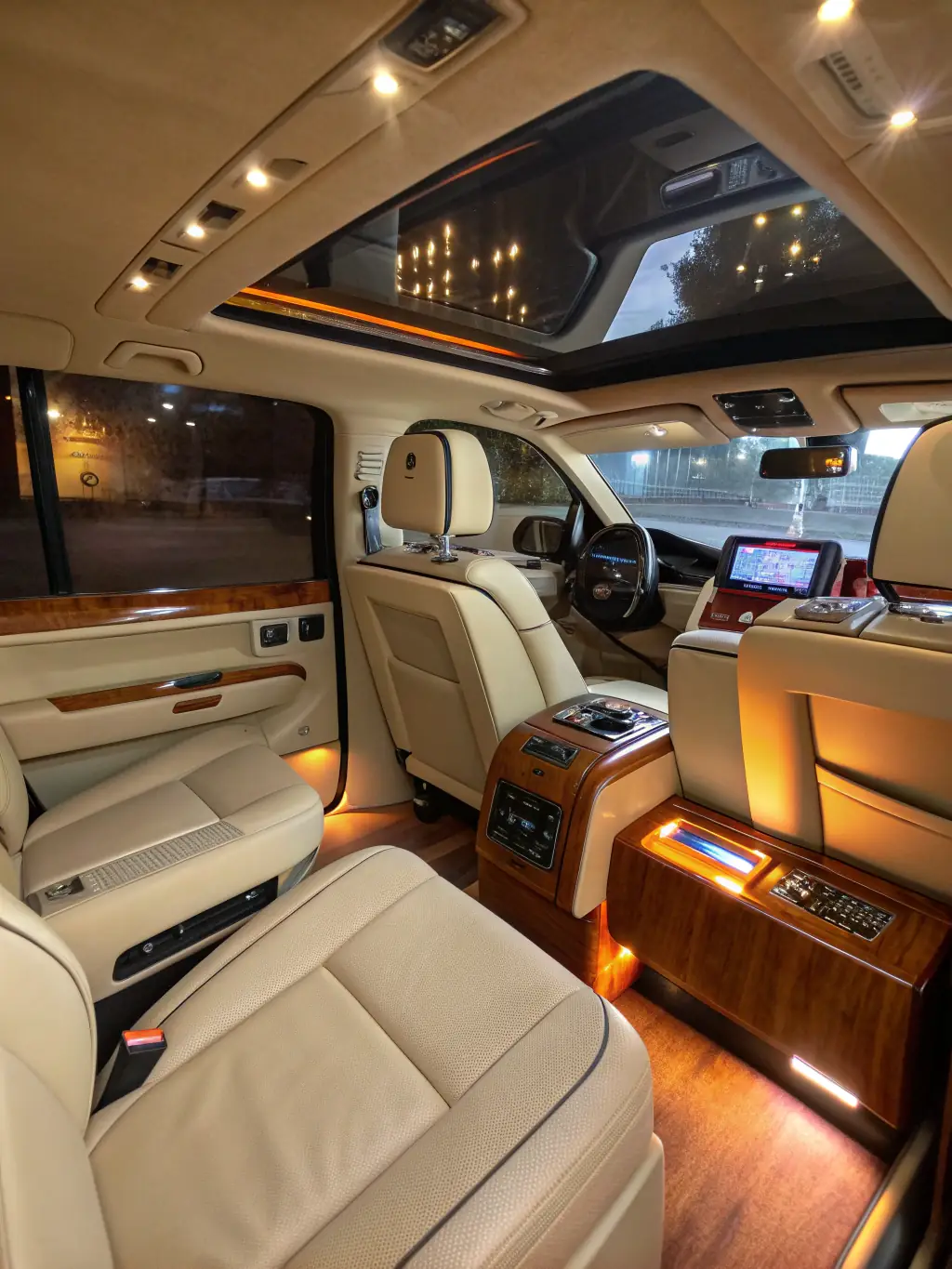 The interior of a luxury FW Limo SUV, showcasing leather seats, ambient lighting, and a bottle of chilled water, creating a comfortable atmosphere.